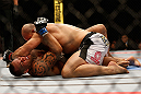 LAS VEGAS, NV - MAY 25:   Glover Teixeira (top) punches James Te-Huna in their light heavyweight bout during UFC 160 at the MGM Grand Garden Arena on May 25, 2013 in Las Vegas, Nevada.  (Photo by Josh Hedges/Zuffa LLC/Zuffa LLC via Getty Images)  *** Local Caption *** Glover Teixeira; James Te-Huna
