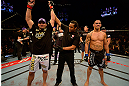 LAS VEGAS, NV - MAY 25:   Glover Teixeira (left) reactions to his victory over James Te-Huna (right) in their light heavyweight bout during UFC 160 at the MGM Grand Garden Arena on May 25, 2013 in Las Vegas, Nevada.  (Photo by Donald Miralle/Zuffa LLC/Zuffa LLC via Getty Images)  *** Local Caption *** Glover Teixeira; James Te-Huna