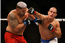 LAS VEGAS, NV - MAY 25:   (R-L) Junior dos Santos punches Mark Hunt in their heavyweight bout during UFC 160 at the MGM Grand Garden Arena on May 25, 2013 in Las Vegas, Nevada.  (Photo by Josh Hedges/Zuffa LLC/Zuffa LLC via Getty Images)  *** Local Caption *** Junior dos Santos; Mark Hunt