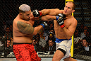 LAS VEGAS, NV - MAY 25:   (R-L) Junior dos Santos punches Mark Hunt in their heavyweight bout during UFC 160 at the MGM Grand Garden Arena on May 25, 2013 in Las Vegas, Nevada.  (Photo by Donald Miralle/Zuffa LLC/Zuffa LLC via Getty Images)  *** Local Caption *** Junior dos Santos; Mark Hunt