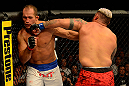 LAS VEGAS, NV - MAY 25:   (R-L) Mark Hunt punches Junior dos Santos in their heavyweight bout during UFC 160 at the MGM Grand Garden Arena on May 25, 2013 in Las Vegas, Nevada.  (Photo by Donald Miralle/Zuffa LLC/Zuffa LLC via Getty Images)  *** Local Caption *** Junior dos Santos; Mark Hunt
