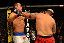 LAS VEGAS, NV - MAY 25:   (R-L) Mark Hunt punches Junior dos Santos in their heavyweight bout during UFC 160 at the MGM Grand Garden Arena on May 25, 2013 in Las Vegas, Nevada.  (Photo by Donald Miralle/Zuffa LLC/Zuffa LLC via Getty Images)  *** Local Caption *** Junior dos Santos; Mark Hunt