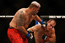 LAS VEGAS, NV - MAY 25:   (L-R) Mark Hunt punches Junior dos Santos in their heavyweight bout during UFC 160 at the MGM Grand Garden Arena on May 25, 2013 in Las Vegas, Nevada.  (Photo by Josh Hedges/Zuffa LLC/Zuffa LLC via Getty Images)  *** Local Caption *** Junior dos Santos; Mark Hunt