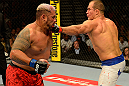 LAS VEGAS, NV - MAY 25:   (R-L) Junior dos Santos punches Mark Hunt in their heavyweight bout during UFC 160 at the MGM Grand Garden Arena on May 25, 2013 in Las Vegas, Nevada.  (Photo by Donald Miralle/Zuffa LLC/Zuffa LLC via Getty Images)  *** Local Caption *** Junior dos Santos; Mark Hunt