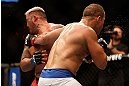 LAS VEGAS, NV - MAY 25:   (R-L) Junior dos Santos punches Mark Hunt in their heavyweight bout during UFC 160 at the MGM Grand Garden Arena on May 25, 2013 in Las Vegas, Nevada.  (Photo by Josh Hedges/Zuffa LLC/Zuffa LLC via Getty Images)  *** Local Caption *** Junior dos Santos; Mark Hunt