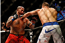 LAS VEGAS, NV - MAY 25:   (R-L) Junior dos Santos punches Mark Hunt in their heavyweight bout during UFC 160 at the MGM Grand Garden Arena on May 25, 2013 in Las Vegas, Nevada.  (Photo by Josh Hedges/Zuffa LLC/Zuffa LLC via Getty Images)  *** Local Caption *** Junior dos Santos; Mark Hunt
