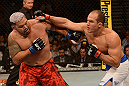 LAS VEGAS, NV - MAY 25:   (R-L) Junior dos Santos punches Mark Hunt in their heavyweight bout during UFC 160 at the MGM Grand Garden Arena on May 25, 2013 in Las Vegas, Nevada.  (Photo by Donald Miralle/Zuffa LLC/Zuffa LLC via Getty Images)  *** Local Caption *** Junior dos Santos; Mark Hunt