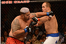LAS VEGAS, NV - MAY 25:   (R-L) Mark Hunt punches Junior dos Santos in their heavyweight bout during UFC 160 at the MGM Grand Garden Arena on May 25, 2013 in Las Vegas, Nevada.  (Photo by Donald Miralle/Zuffa LLC/Zuffa LLC via Getty Images)  *** Local Caption *** Junior dos Santos; Mark Hunt