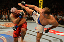 LAS VEGAS, NV - MAY 25:   (R-L) Junior dos Santos kicks Mark Hunt in their heavyweight bout during UFC 160 at the MGM Grand Garden Arena on May 25, 2013 in Las Vegas, Nevada.  (Photo by Donald Miralle/Zuffa LLC/Zuffa LLC via Getty Images)  *** Local Caption *** Junior dos Santos; Mark Hunt