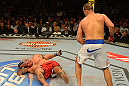 LAS VEGAS, NV - MAY 25:   (R-L) Junior dos Santos reacts to knocking down Mark Hunt in their heavyweight bout during UFC 160 at the MGM Grand Garden Arena on May 25, 2013 in Las Vegas, Nevada.  (Photo by Donald Miralle/Zuffa LLC/Zuffa LLC via Getty Images)  *** Local Caption *** Junior dos Santos; Mark Hunt