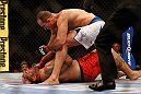LAS VEGAS, NV - MAY 25:   Junior dos Santos (top) punches Mark Hunt in their heavyweight bout during UFC 160 at the MGM Grand Garden Arena on May 25, 2013 in Las Vegas, Nevada.  (Photo by Josh Hedges/Zuffa LLC/Zuffa LLC via Getty Images)  *** Local Caption *** Junior dos Santos; Mark Hunt