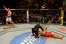 LAS VEGAS, NV - MAY 25:   Junior dos Santos (left) reacts to his knockout victory over Mark Hunt in their heavyweight bout during UFC 160 at the MGM Grand Garden Arena on May 25, 2013 in Las Vegas, Nevada.  (Photo by Donald Miralle/Zuffa LLC/Zuffa LLC via Getty Images)  *** Local Caption *** Junior dos Santos; Mark Hunt