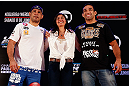 FORTALEZA, BRAZIL - JUNE 06:  Opponents Antonio Rodrigo "Minotauro" Nogueira (L) and Fabricio Werdum pose for photos with UFC vice president Grace Tourinho at Centro de Eventos do Ceara on June 6, 2013 in Fortaleza, Ceara, Brazil.  (Photo by Josh Hedges/Zuffa LLC/Zuffa LLC via Getty Images)