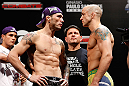 FORTALEZA, BRAZIL - JUNE 07:  (L-R) Opponents Rony "Jason" Mariano Bezerra and Mike Wilkinson face off during the UFC weigh-in at Paulo Sarasate Arena on June 7, 2013 in Fortaleza, Ceara, Brazil.  (Photo by Josh Hedges/Zuffa LLC/Zuffa LLC via Getty Images)