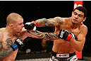 FORTALEZA, BRAZIL - JUNE 08:  (R-L) Antonio Braga Neto punches Anthony Smith in their middleweight fight during the UFC on FUEL TV event at Paulo Sarasate Arena on June 8, 2013 in Fortaleza, Ceara, Brazil.  (Photo by Josh Hedges/Zuffa LLC/Zuffa LLC via Getty Images)
