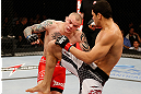 FORTALEZA, BRAZIL - JUNE 08:  (R-L) Antonio Braga Neto knees Anthony Smith in their middleweight fight during the UFC on FUEL TV event at Paulo Sarasate Arena on June 8, 2013 in Fortaleza, Ceara, Brazil.  (Photo by Josh Hedges/Zuffa LLC/Zuffa LLC via Getty Images)