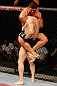 FORTALEZA, BRAZIL - JUNE 08:  Caio Magalhaes (top) attempts a guillotine choke against Karlos Vemola in their middleweight fight during the UFC on FUEL TV event at Paulo Sarasate Arena on June 8, 2013 in Fortaleza, Ceara, Brazil.  (Photo by Josh Hedges/Zuffa LLC/Zuffa LLC via Getty Images)