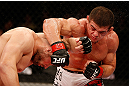 FORTALEZA, BRAZIL - JUNE 08:  (R-L) Caio Magalhaes punches Karlos Vemola in their middleweight fight during the UFC on FUEL TV event at Paulo Sarasate Arena on June 8, 2013 in Fortaleza, Ceara, Brazil.  (Photo by Josh Hedges/Zuffa LLC/Zuffa LLC via Getty Images)