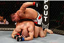 FORTALEZA, BRAZIL - JUNE 08:  Caio Magalhaes (top) punches Karlos Vemola in their middleweight fight during the UFC on FUEL TV event at Paulo Sarasate Arena on June 8, 2013 in Fortaleza, Ceara, Brazil.  (Photo by Josh Hedges/Zuffa LLC/Zuffa LLC via Getty Images)