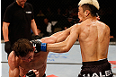 FORTALEZA, BRAZIL - JUNE 08:  (L-R) Rodrigo Damm and Mizuto Hirota trade punches in their featherweight fight during the UFC on FUEL TV event at Paulo Sarasate Arena on June 8, 2013 in Fortaleza, Ceara, Brazil.  (Photo by Josh Hedges/Zuffa LLC/Zuffa LLC via Getty Images)