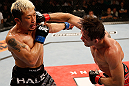 FORTALEZA, BRAZIL - JUNE 08:  (R-L) Rodrigo Damm punches Mizuto Hirota in their featherweight fight during the UFC on FUEL TV event at Paulo Sarasate Arena on June 8, 2013 in Fortaleza, Ceara, Brazil.  (Photo by Josh Hedges/Zuffa LLC/Zuffa LLC via Getty Images)