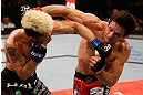 FORTALEZA, BRAZIL - JUNE 08:  (R-L) Rodrigo Damm and Mizuto Hirota trade punches in their featherweight fight during the UFC on FUEL TV event at Paulo Sarasate Arena on June 8, 2013 in Fortaleza, Ceara, Brazil.  (Photo by Josh Hedges/Zuffa LLC/Zuffa LLC via Getty Images)