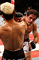 FORTALEZA, BRAZIL - JUNE 08:  (R-L) Rodrigo Damm punches Mizuto Hirota in their featherweight fight during the UFC on FUEL TV event at Paulo Sarasate Arena on June 8, 2013 in Fortaleza, Ceara, Brazil.  (Photo by Josh Hedges/Zuffa LLC/Zuffa LLC via Getty Images)