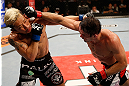 FORTALEZA, BRAZIL - JUNE 08:  (R-L) Rodrigo Damm punches Mizuto Hirota in their featherweight fight during the UFC on FUEL TV event at Paulo Sarasate Arena on June 8, 2013 in Fortaleza, Ceara, Brazil.  (Photo by Josh Hedges/Zuffa LLC/Zuffa LLC via Getty Images)