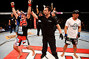 FORTALEZA, BRAZIL - JUNE 08:  Rodrigo Damm (L) reacts after his split decision victory over Mizuto Hirota in their featherweight fight during the UFC on FUEL TV event at Paulo Sarasate Arena on June 8, 2013 in Fortaleza, Ceara, Brazil.  (Photo by Josh Hedges/Zuffa LLC/Zuffa LLC via Getty Images)