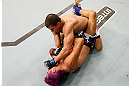 FORTALEZA, BRAZIL - JUNE 08:  Felipe Arantes (top) punches Godofredo "Pepey" Castro in their featherweight fight during the UFC on FUEL TV event at Paulo Sarasate Arena on June 8, 2013 in Fortaleza, Ceara, Brazil.  (Photo by Josh Hedges/Zuffa LLC/Zuffa LLC via Getty Images)