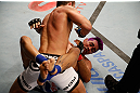 FORTALEZA, BRAZIL - JUNE 08:  Felipe Arantes (top) elbows Godofredo "Pepey" Castro in their featherweight fight during the UFC on FUEL TV event at Paulo Sarasate Arena on June 8, 2013 in Fortaleza, Ceara, Brazil.  (Photo by Josh Hedges/Zuffa LLC/Zuffa LLC via Getty Images)