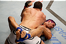 FORTALEZA, BRAZIL - JUNE 08:  Felipe Arantes (top) elbows Godofredo "Pepey" Castro in their featherweight fight during the UFC on FUEL TV event at Paulo Sarasate Arena on June 8, 2013 in Fortaleza, Ceara, Brazil.  (Photo by Josh Hedges/Zuffa LLC/Zuffa LLC via Getty Images)