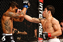 FORTALEZA, BRAZIL - JUNE 08:  (R-L) Raphael Assuncao punches Vaughan Lee in their bantamweight fight during the UFC on FUEL TV event at Paulo Sarasate Arena on June 8, 2013 in Fortaleza, Ceara, Brazil.  (Photo by Josh Hedges/Zuffa LLC/Zuffa LLC via Getty Images)