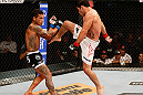 FORTALEZA, BRAZIL - JUNE 08:  (R-L) Raphael Assuncao throws a flying knee against Vaughan Lee in their bantamweight fight during the UFC on FUEL TV event at Paulo Sarasate Arena on June 8, 2013 in Fortaleza, Ceara, Brazil.  (Photo by Josh Hedges/Zuffa LLC/Zuffa LLC via Getty Images)