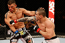 FORTALEZA, BRAZIL - JUNE 08:  (R-L) Daniel Sarafian punches Eddie Mendez in their middleweight fight during the UFC on FUEL TV event at Paulo Sarasate Arena on June 8, 2013 in Fortaleza, Ceara, Brazil.  (Photo by Josh Hedges/Zuffa LLC/Zuffa LLC via Getty Images)