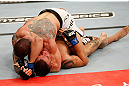 FORTALEZA, BRAZIL - JUNE 08:  (L-R) Daniel Sarafian secures an arm triangle choke submission against Eddie Mendez in their middleweight fight during the UFC on FUEL TV event at Paulo Sarasate Arena on June 8, 2013 in Fortaleza, Ceara, Brazil.  (Photo by Josh Hedges/Zuffa LLC/Zuffa LLC via Getty Images)