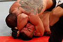 FORTALEZA, BRAZIL - JUNE 08:  (L-R) Daniel Sarafian secures an arm triangle choke submission against Eddie Mendez in their middleweight fight during the UFC on FUEL TV event at Paulo Sarasate Arena on June 8, 2013 in Fortaleza, Ceara, Brazil.  (Photo by Josh Hedges/Zuffa LLC/Zuffa LLC via Getty Images)