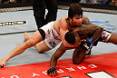 FORTALEZA, BRAZIL - JUNE 08:  (L-R) Erick Silva grapples with Jason High in their welterweight fight during the UFC on FUEL TV event at Paulo Sarasate Arena on June 8, 2013 in Fortaleza, Ceara, Brazil.  (Photo by Josh Hedges/Zuffa LLC/Zuffa LLC via Getty Images)