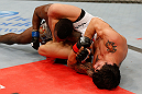 FORTALEZA, BRAZIL - JUNE 08:  (R-L) Erick Silva secures an arm bar submission against Jason High in their welterweight fight during the UFC on FUEL TV event at Paulo Sarasate Arena on June 8, 2013 in Fortaleza, Ceara, Brazil.  (Photo by Josh Hedges/Zuffa LLC/Zuffa LLC via Getty Images)