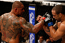 FORTALEZA, BRAZIL - JUNE 08:  (L-R) Thiago Silva punches Rafael "Feijao" Cavalcante in their light heavyweight fight during the UFC on FUEL TV event at Paulo Sarasate Arena on June 8, 2013 in Fortaleza, Ceara, Brazil.  (Photo by Josh Hedges/Zuffa LLC/Zuffa LLC via Getty Images)