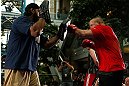 WINNIPEG, CANADA - JUNE 12:  (R-L) Pat Barry works out with former CFL football player Obby Khan during an open workout session for fans and media at Portage Place on June 12, 2013 in Winnipeg, Manitoba, Canada.  (Photo by Josh Hedges/Zuffa LLC/Zuffa LLC via Getty Images)