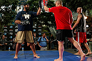 WINNIPEG, CANADA - JUNE 12:  (R-L) Pat Barry works out with former CFL football player Obby Khan during an open workout session for fans and media at Portage Place on June 12, 2013 in Winnipeg, Manitoba, Canada.  (Photo by Josh Hedges/Zuffa LLC/Zuffa LLC via Getty Images)