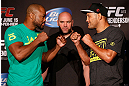 WINNIPEG, CANADA - JUNE 13:  (L-R) Opponents Rashad Evans and Dan Henderson face off during the UFC 161 media day at The Met on June 13, 2013 in Winnipeg, Manitoba, Canada.  (Photo by Josh Hedges/Zuffa LLC/Zuffa LLC via Getty Images)