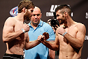 WINNIPEG, CANADA - JUNE 14:  (L-R) Opponents Mitch Clarke and John Maguire face off during the UFC 161 weigh-in at the MTS Centre on June 14, 2013 in Winnipeg, Manitoba, Canada.  (Photo by Josh Hedges/Zuffa LLC/Zuffa LLC via Getty Images)