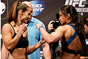 WINNIPEG, CANADA - JUNE 14:  (L-R) Opponents Alexis Davis and Rosi Sexton face off during the UFC 161 weigh-in at the MTS Centre on June 14, 2013 in Winnipeg, Manitoba, Canada.  (Photo by Josh Hedges/Zuffa LLC/Zuffa LLC via Getty Images)