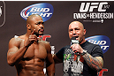 WINNIPEG, CANADA - JUNE 14:  (L-R) Rashad Evans is interviewed by Joe Rogan during the UFC 161 weigh-in at the MTS Centre on June 14, 2013 in Winnipeg, Manitoba, Canada.  (Photo by Josh Hedges/Zuffa LLC/Zuffa LLC via Getty Images)