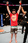 WINNIPEG, CANADA - JUNE 15:  Mitch Clarke reacts after his split decision victory over John Maguire in their lightweight fight during the UFC 161 event at the MTS Centre on June 15, 2013 in Winnipeg, Manitoba, Canada.  (Photo by Josh Hedges/Zuffa LLC/Zuffa LLC via Getty Images)