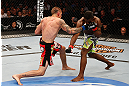 WINNIPEG, CANADA - JUNE 15:  (L-R) Dustin Pague punches Yves Jabouin in their bantamweight fight during the UFC 161 event at the MTS Centre on June 15, 2013 in Winnipeg, Manitoba, Canada.  (Photo by Josh Hedges/Zuffa LLC/Zuffa LLC via Getty Images)