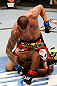 WINNIPEG, CANADA - JUNE 15:  Dustin Pague (top) punches Yves Jabouin in their bantamweight fight during the UFC 161 event at the MTS Centre on June 15, 2013 in Winnipeg, Manitoba, Canada.  (Photo by Josh Hedges/Zuffa LLC/Zuffa LLC via Getty Images)