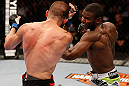 WINNIPEG, CANADA - JUNE 15:  (R-L) Yves Jabouin punches Dustin Pague in their bantamweight fight during the UFC 161 event at the MTS Centre on June 15, 2013 in Winnipeg, Manitoba, Canada.  (Photo by Josh Hedges/Zuffa LLC/Zuffa LLC via Getty Images)